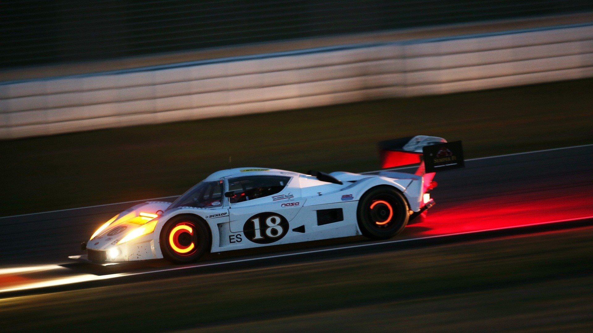 White race car with number 18 on a race track HD Wallpaper
