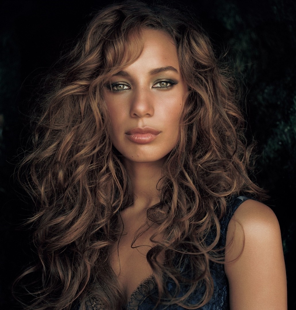 Woman with long curly brown hair and green eyes HD Wallpaper