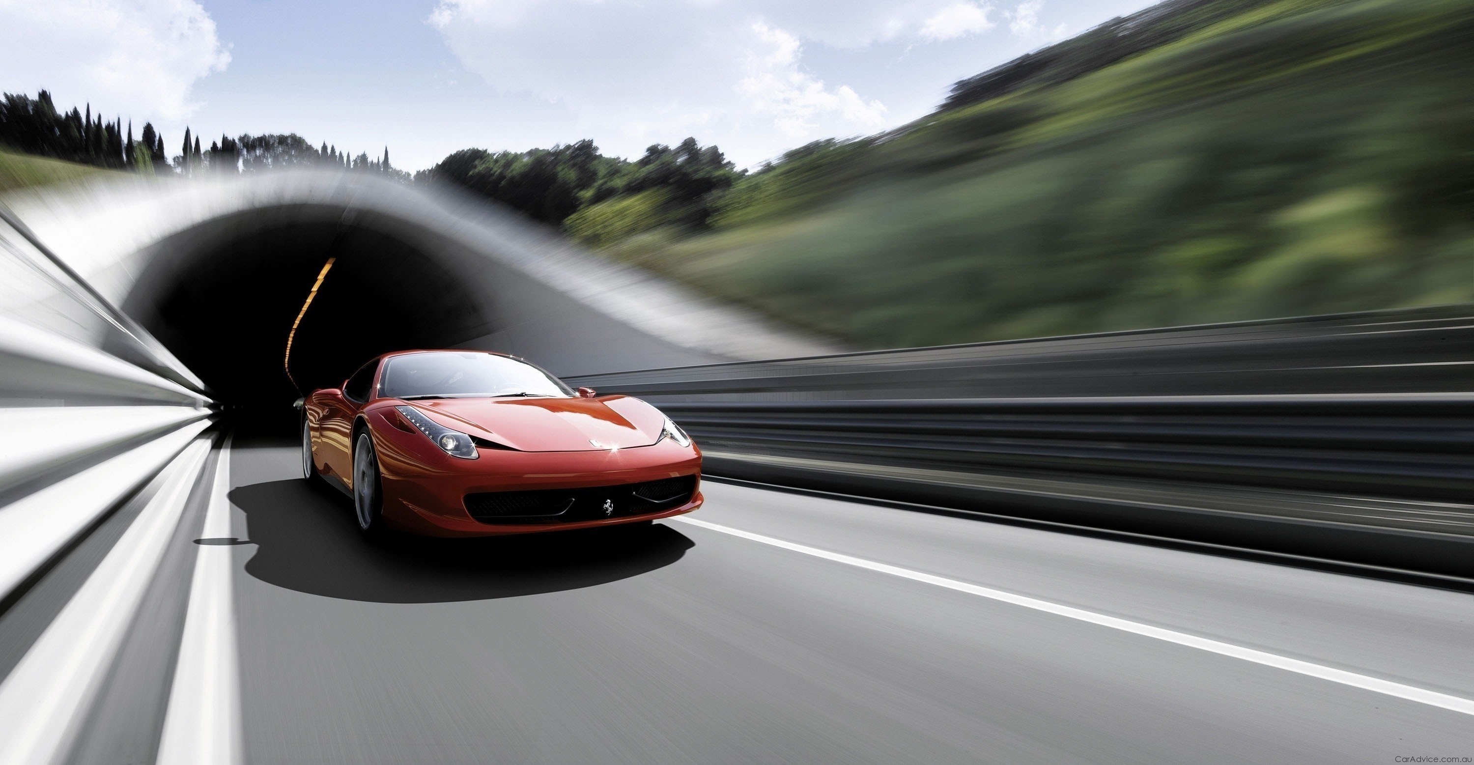 Red Ferrari 458 driving out of a tunnel HD Wallpaper