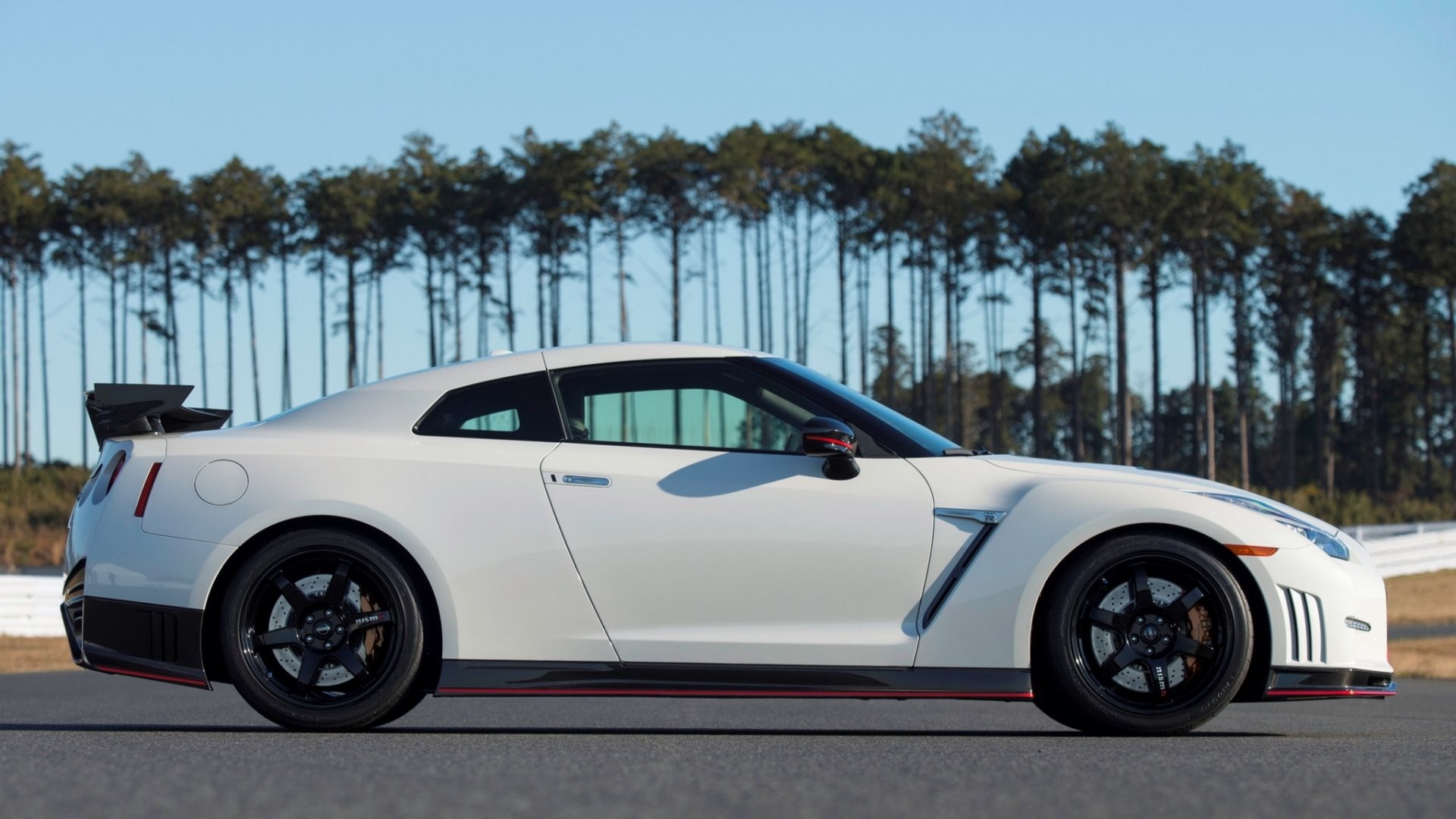 White Nissan GT-R Nismo parked on a track HD Wallpaper
