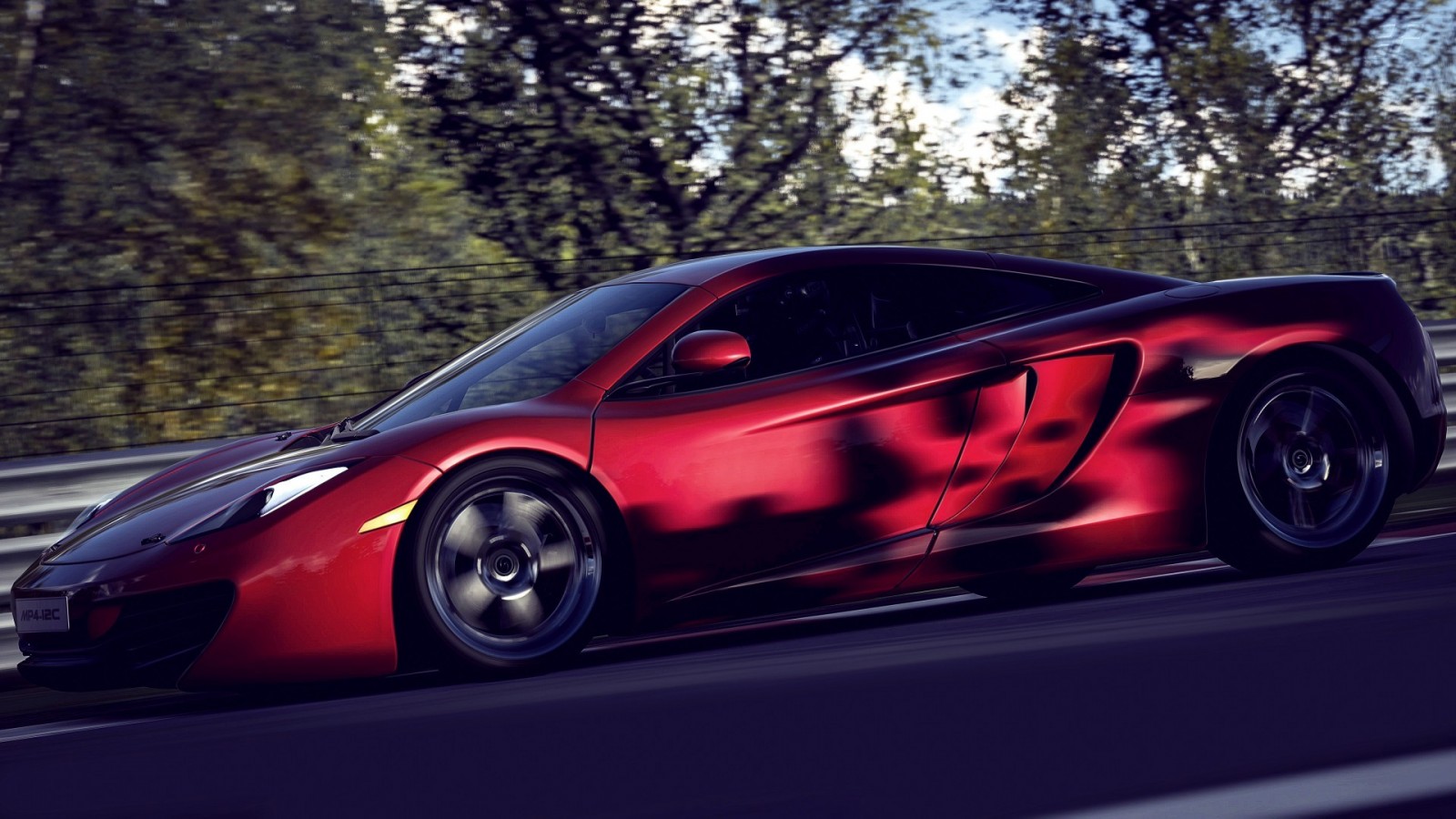 Red McLaren MP4-12C sports car on a track HD Wallpaper