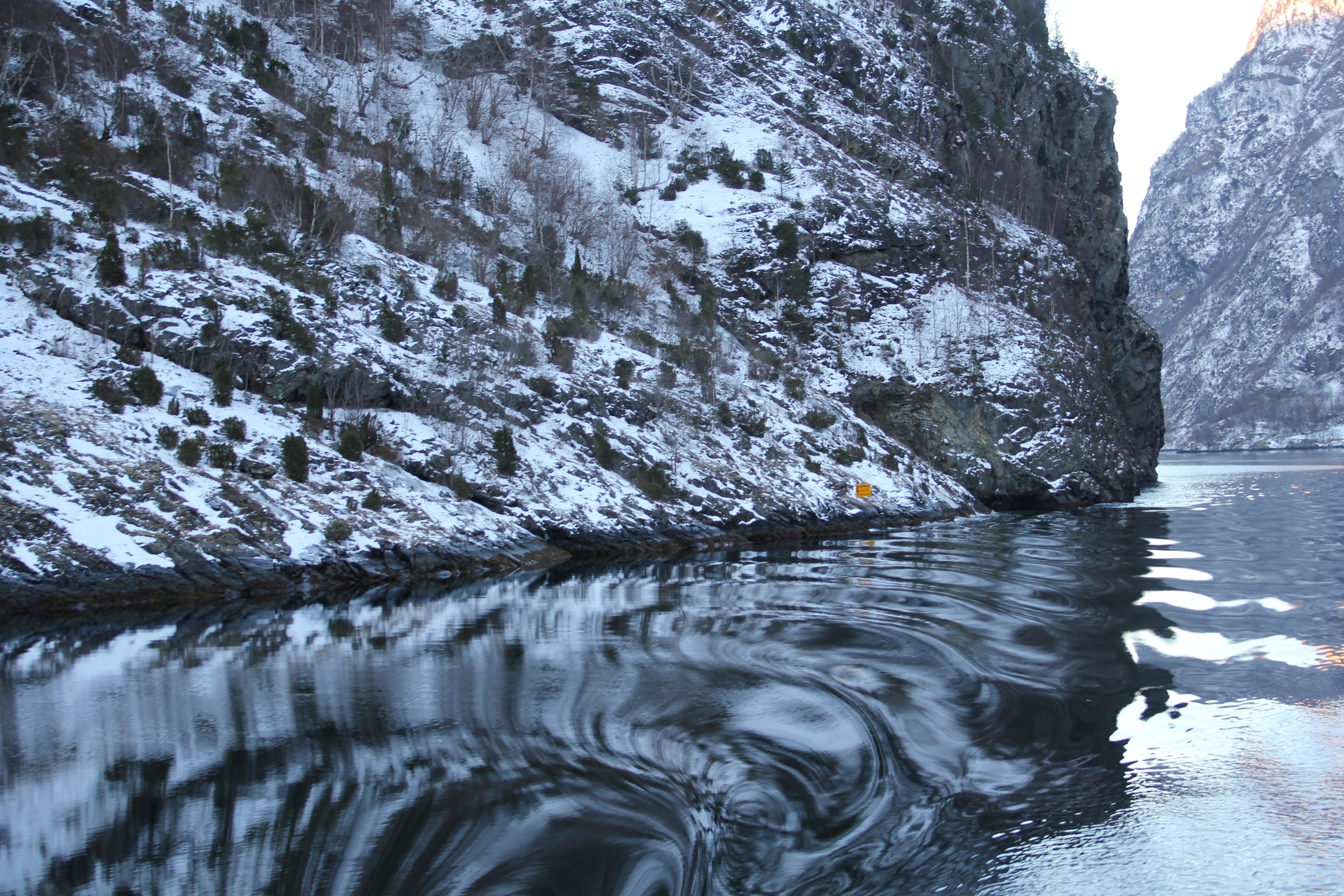 Snowy mountains reflected in a fjord HD Wallpaper