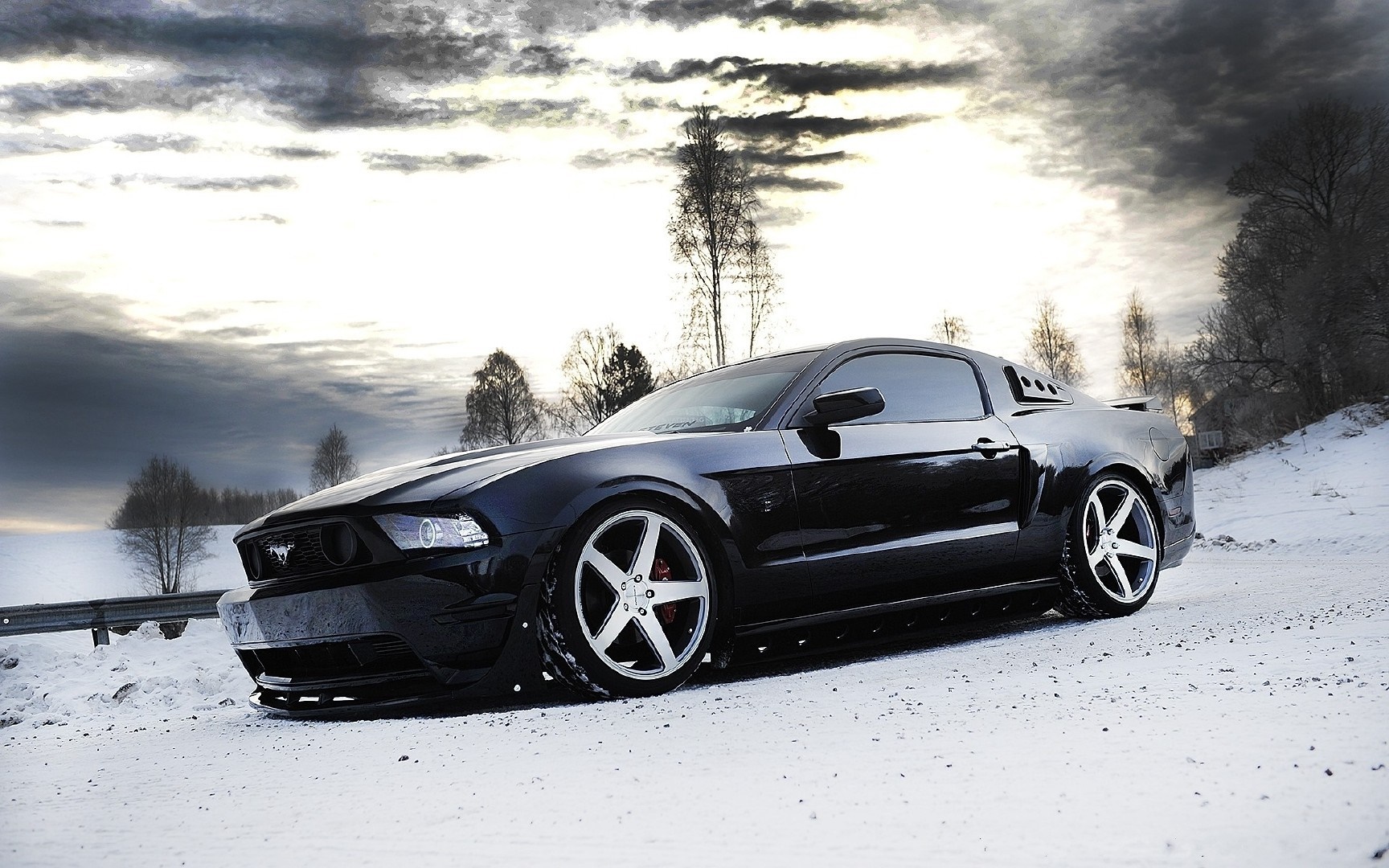 Black Ford Mustang in a Snowy Landscape HD Wallpaper