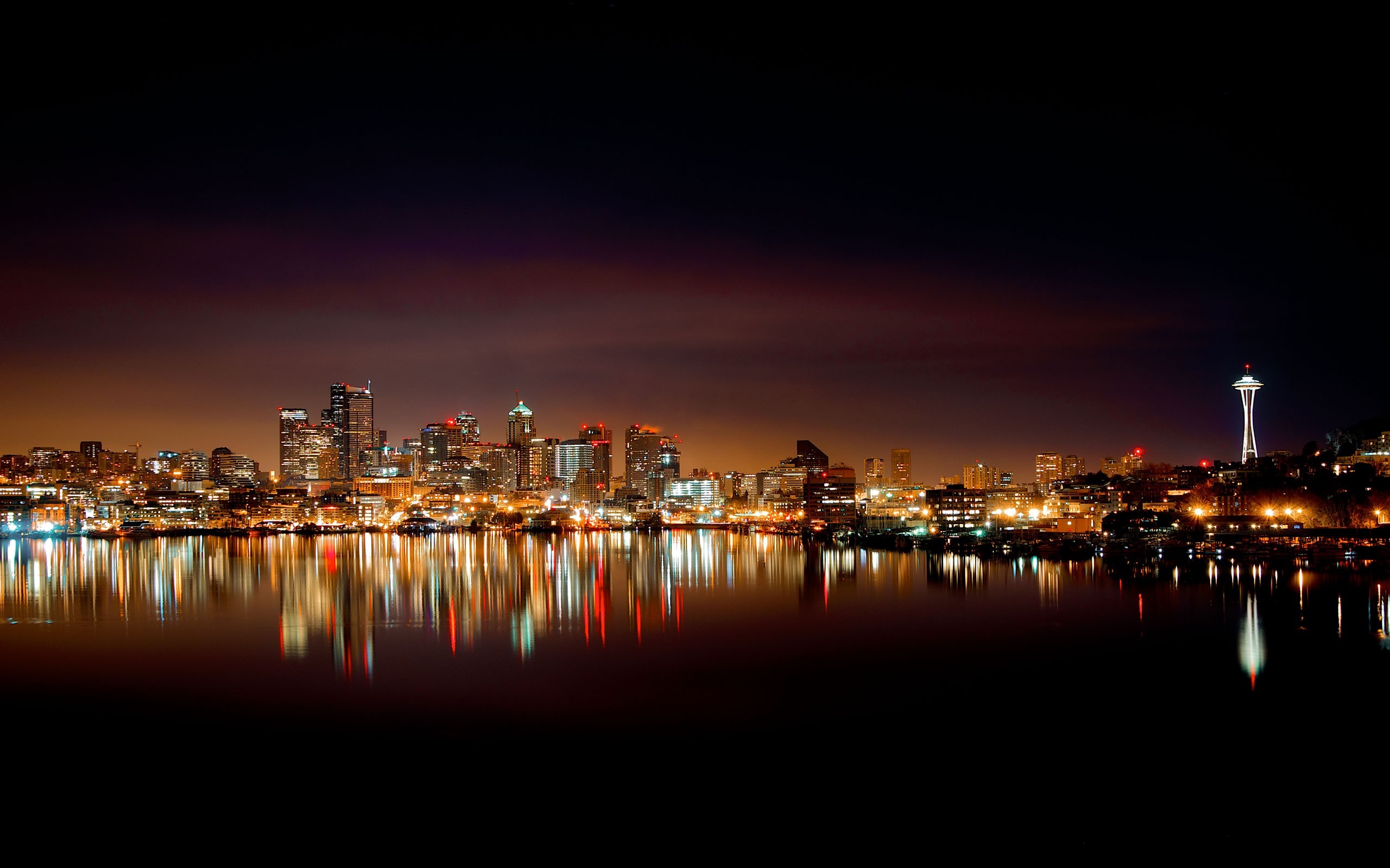 Seattle skyline at night with Space Needle and water reflection HD Wallpaper