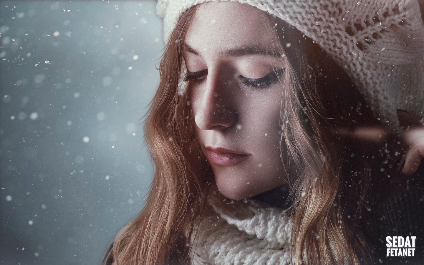 Woman in winter hat and scarf in snow HD Wallpaper