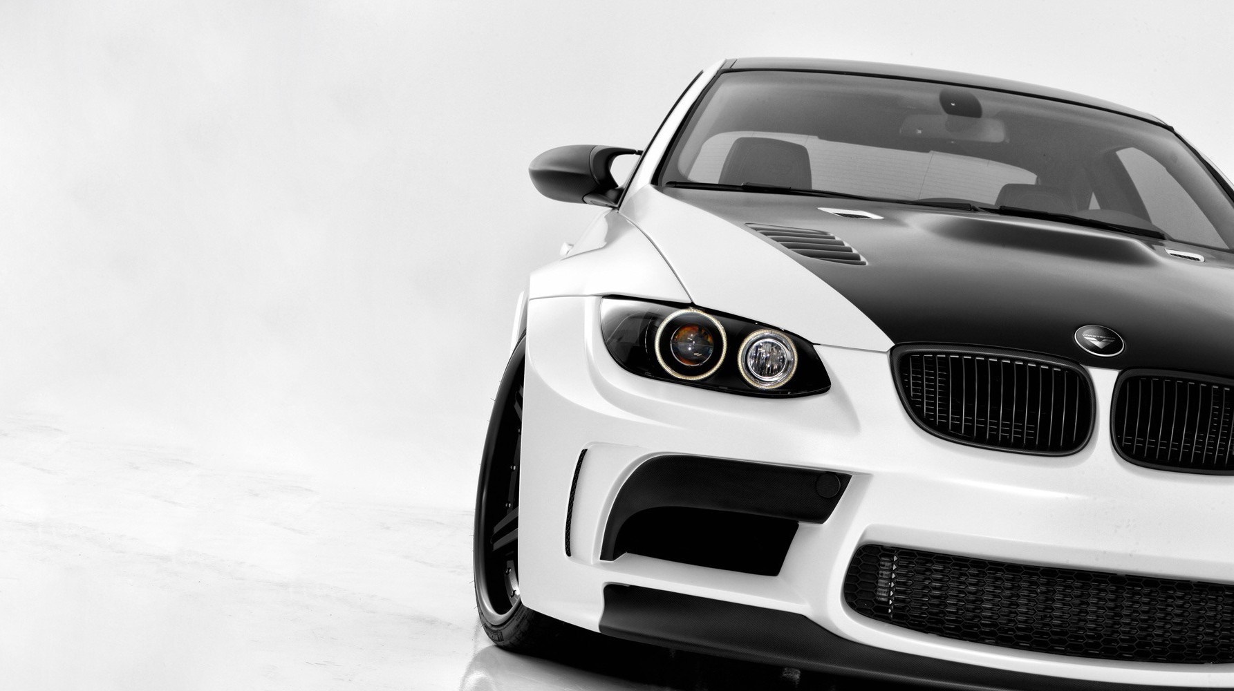 White and black BMW M3 sports car front view HD Wallpaper