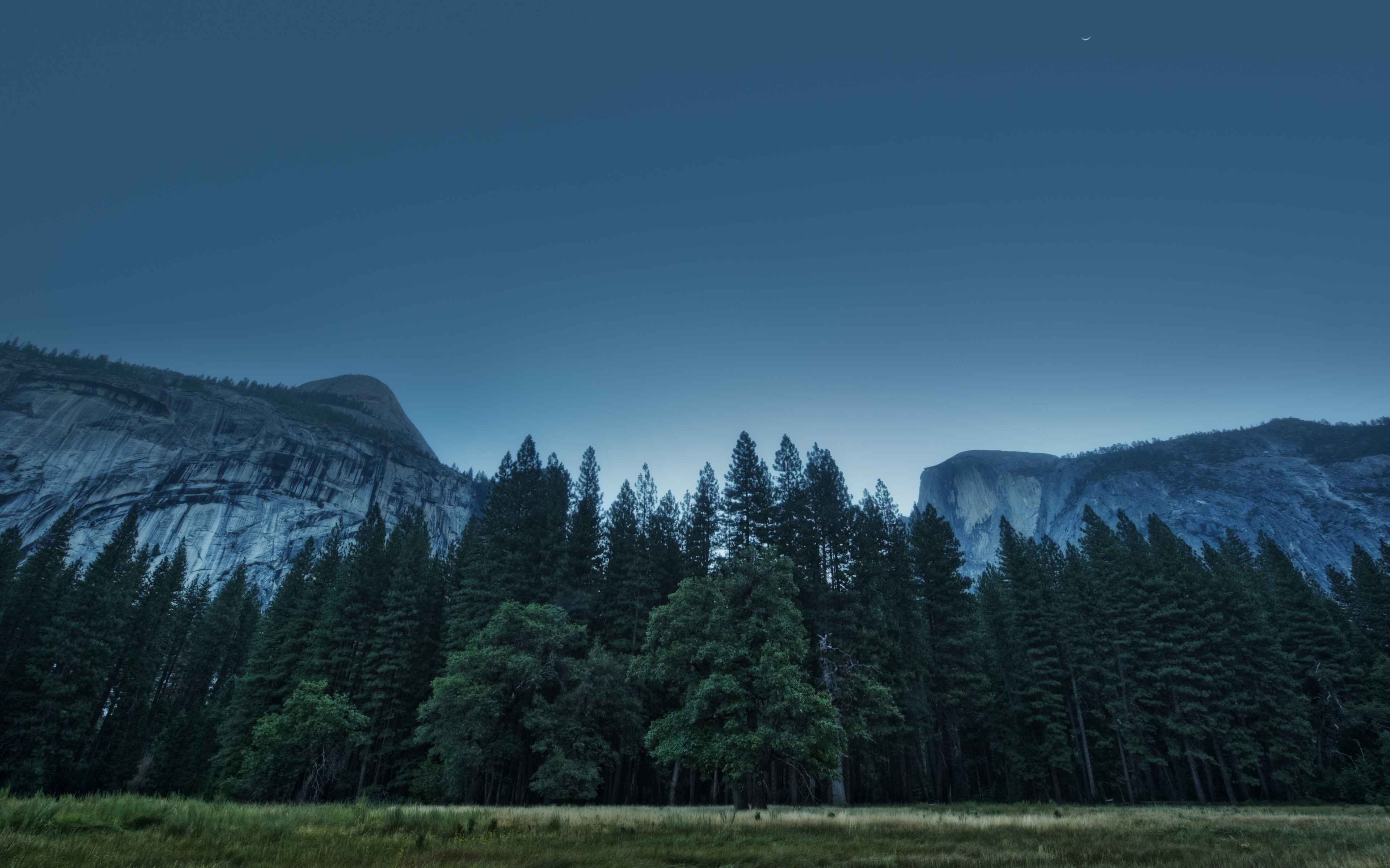 Forest and mountains at dusk with a crescent moon HD Wallpaper