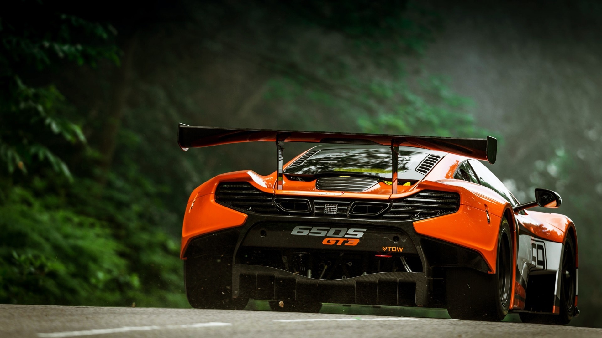 McLaren 650S GT3 race car on a road HD Wallpaper