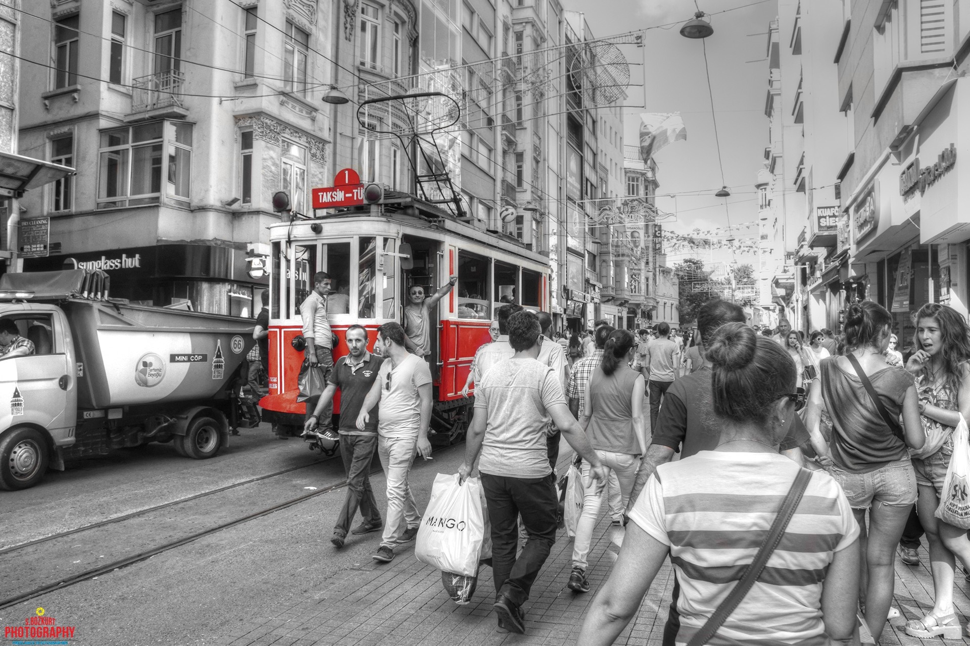 Red tram on Taksim street in Istanbul with pedestrians HD Wallpaper