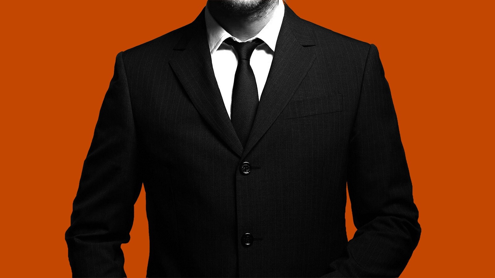 Man in a black pinstripe suit with a tie HD Wallpaper