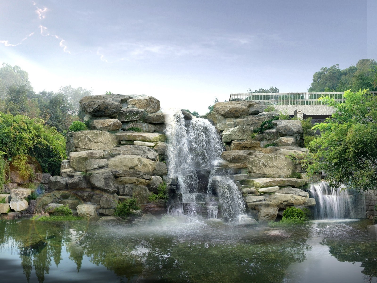Waterfall cascading over rocks into a pond HD Wallpaper