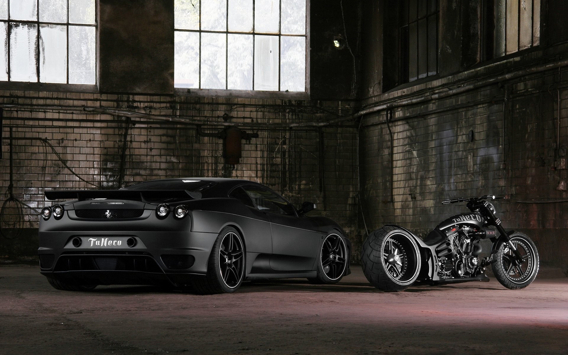 Black Ferrari F430 and custom motorcycle in garage HD Wallpaper