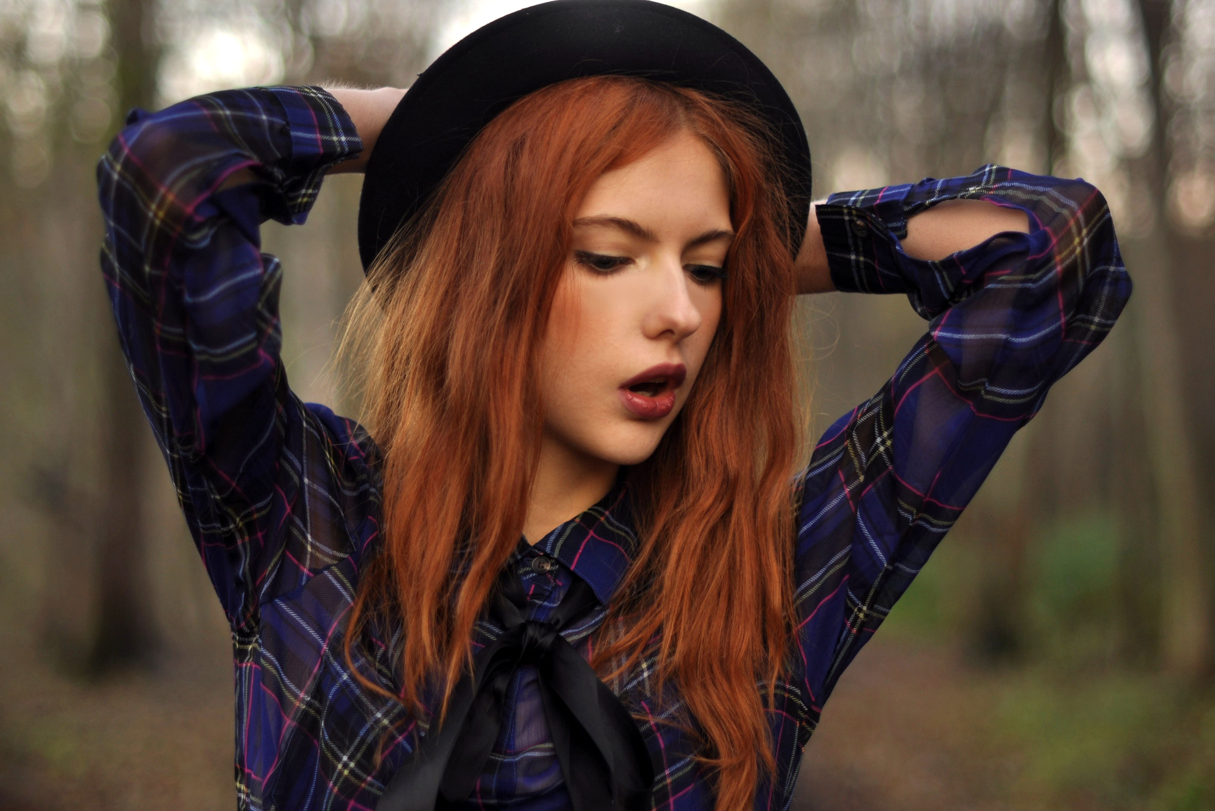Woman with red hair wearing a hat and plaid shirt HD Wallpaper
