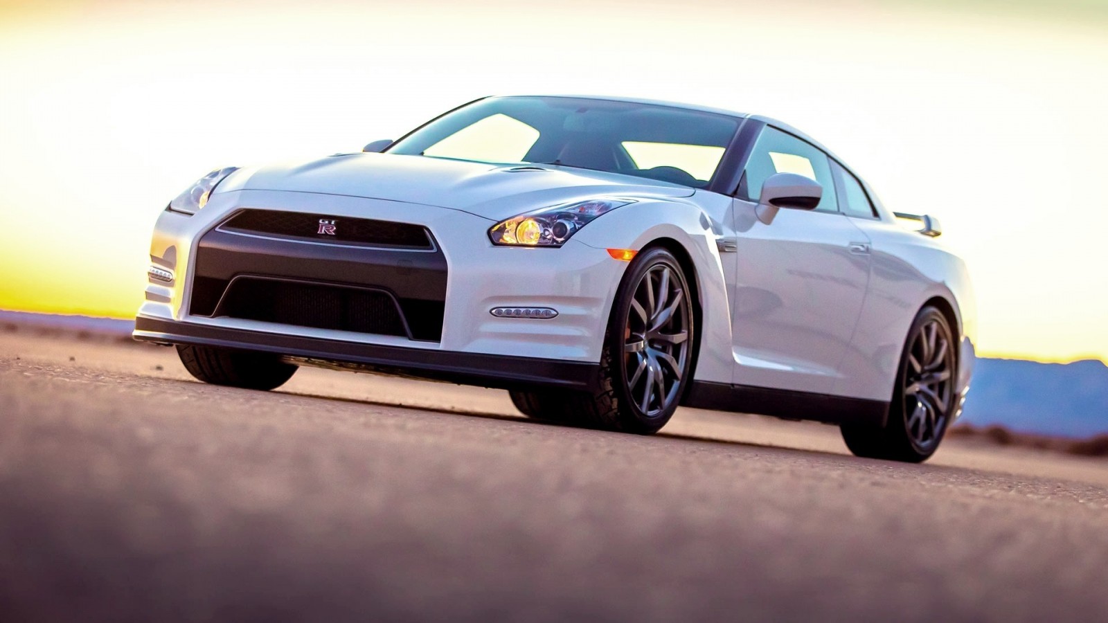 White Nissan GT-R sports car on a road HD Wallpaper