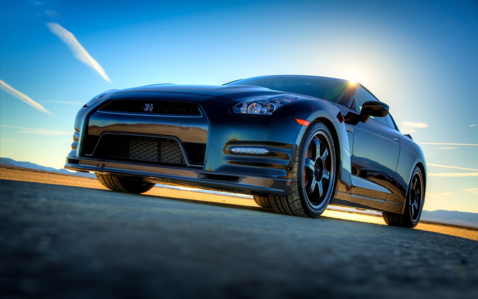 Black Nissan GT-R sports car on a road HD Wallpaper