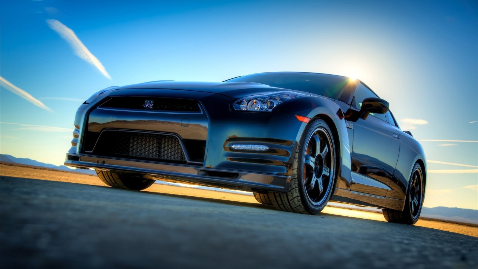 Black Nissan GT-R sports car on a desert road HD Wallpaper