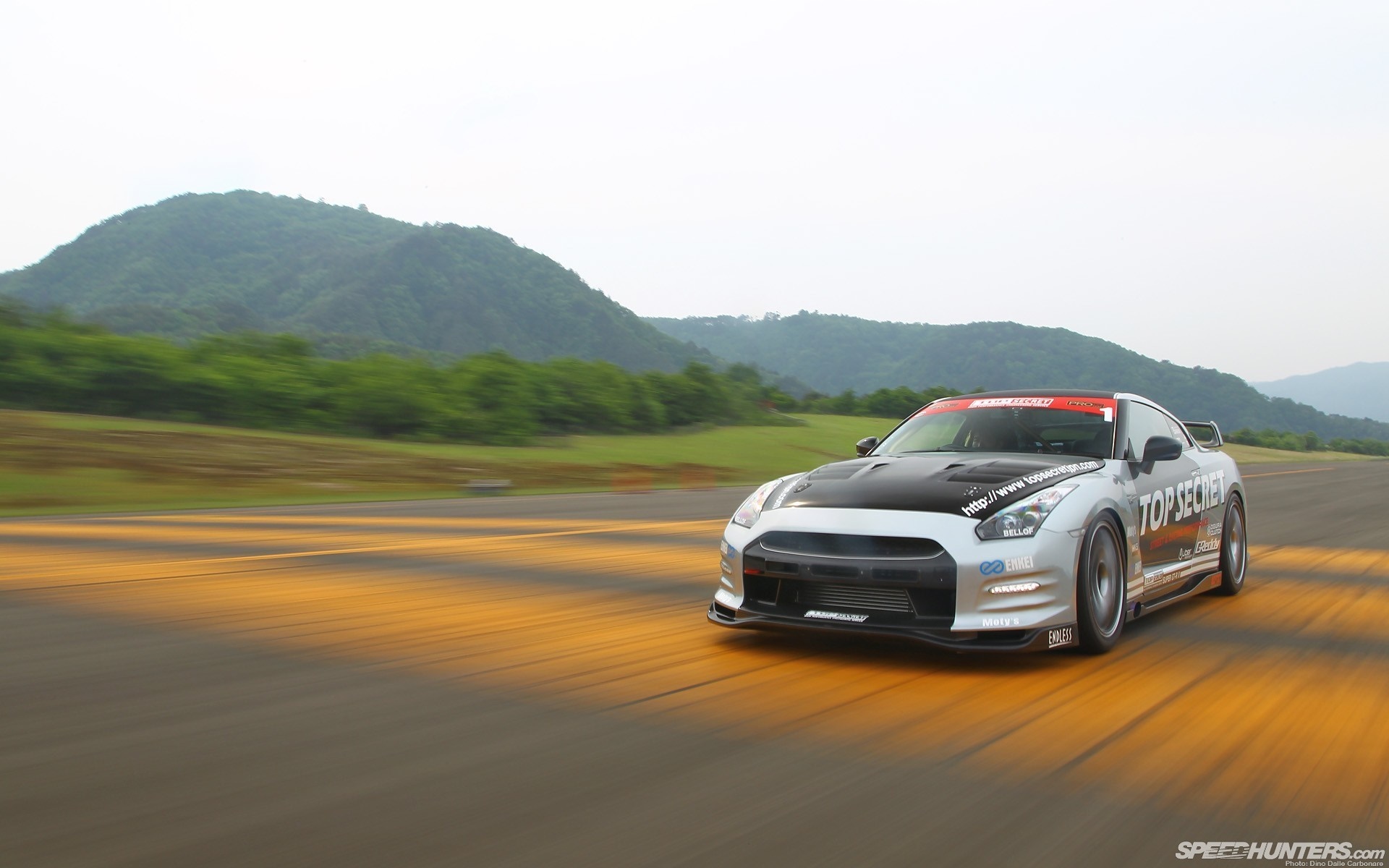 Nissan GT-R "Top Secret" driving on a track HD Wallpaper