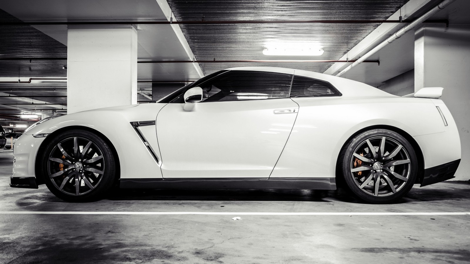 White Nissan GT-R parked in a garage HD Wallpaper