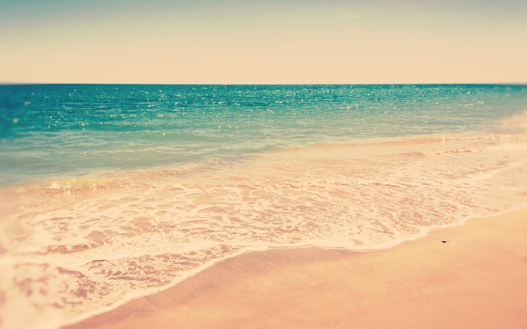 Ocean waves on a sandy beach at sunrise HD Wallpaper