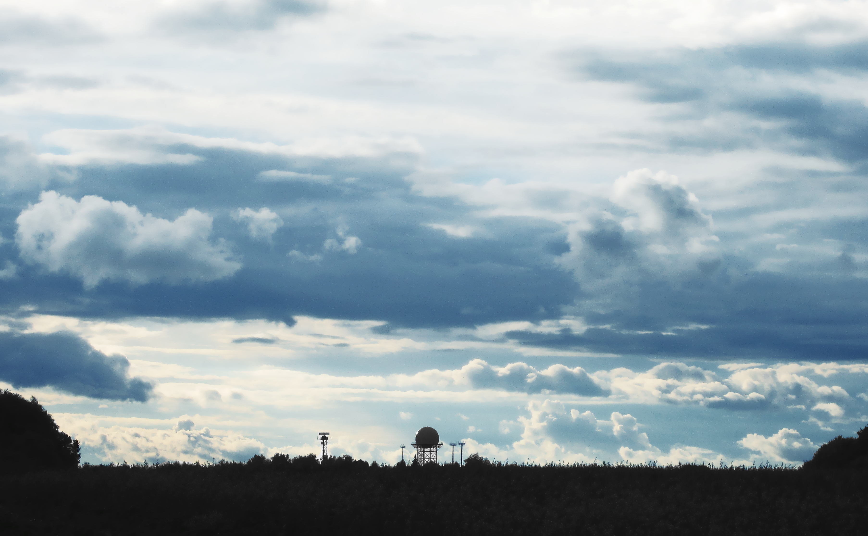 Radar dome on a hill under cloudy sky HD Wallpaper