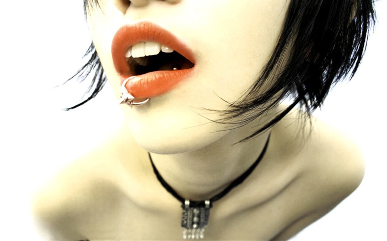 Woman with lip piercing and necklace HD Wallpaper