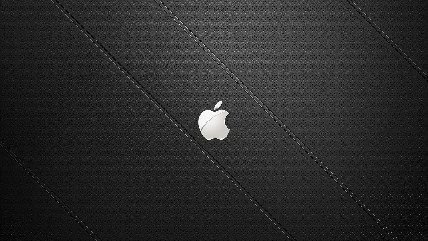 Apple logo on black perforated leather with stitching HD Wallpaper