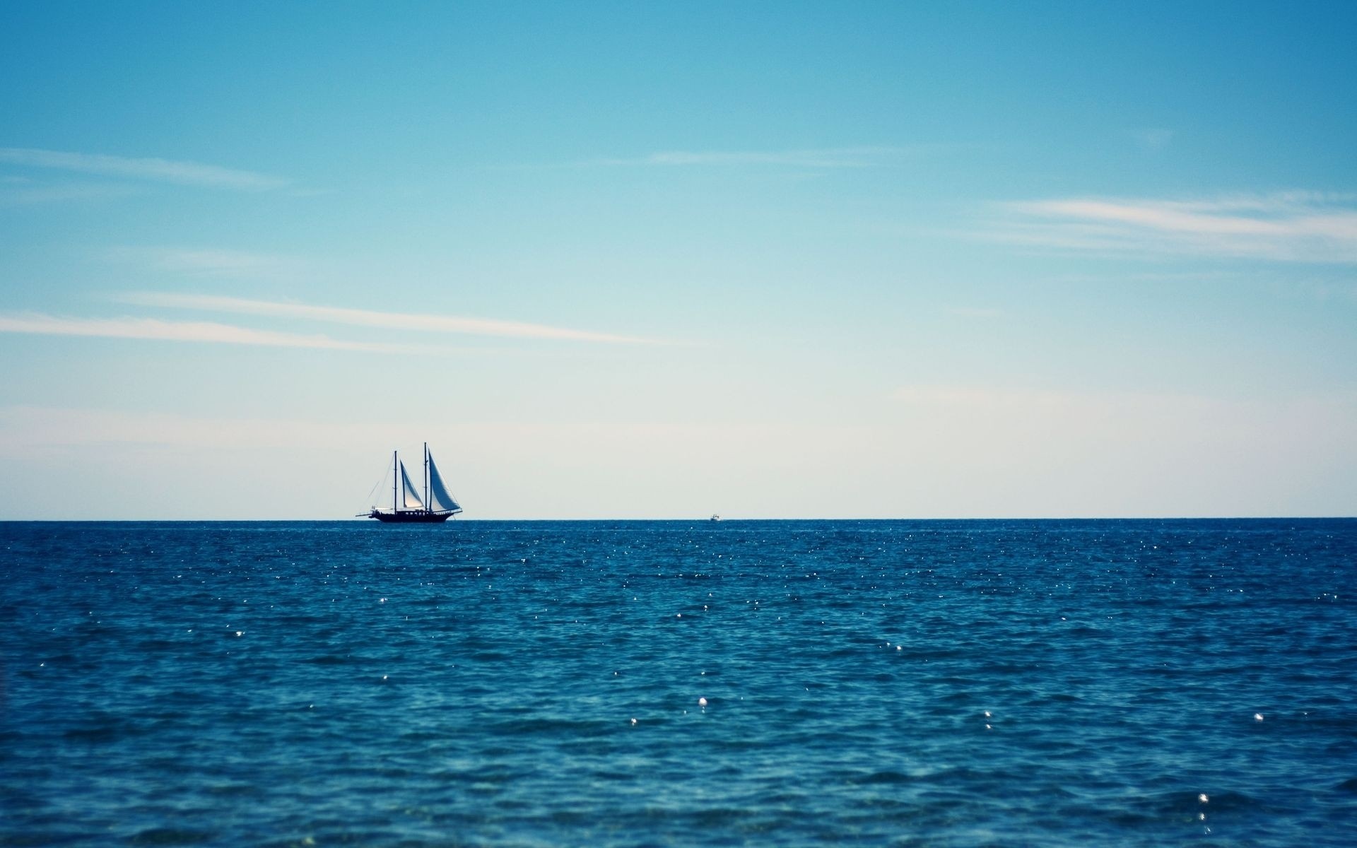 Sailboat on the blue ocean under a clear sky HD Wallpaper
