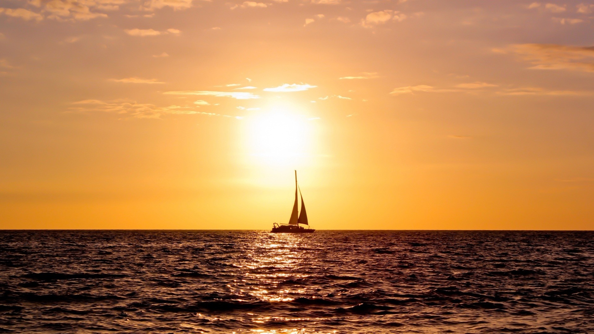 Sailboat on the ocean at sunset HD Wallpaper