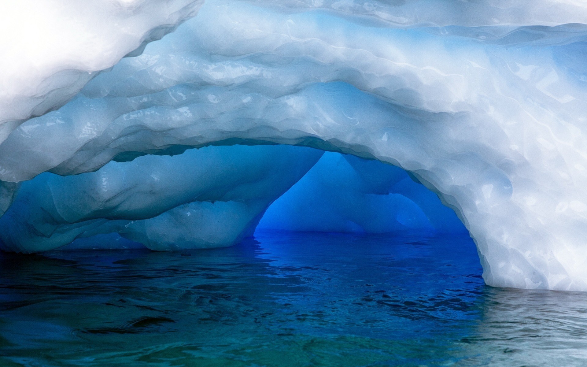 Ice cave with blue water HD Wallpaper