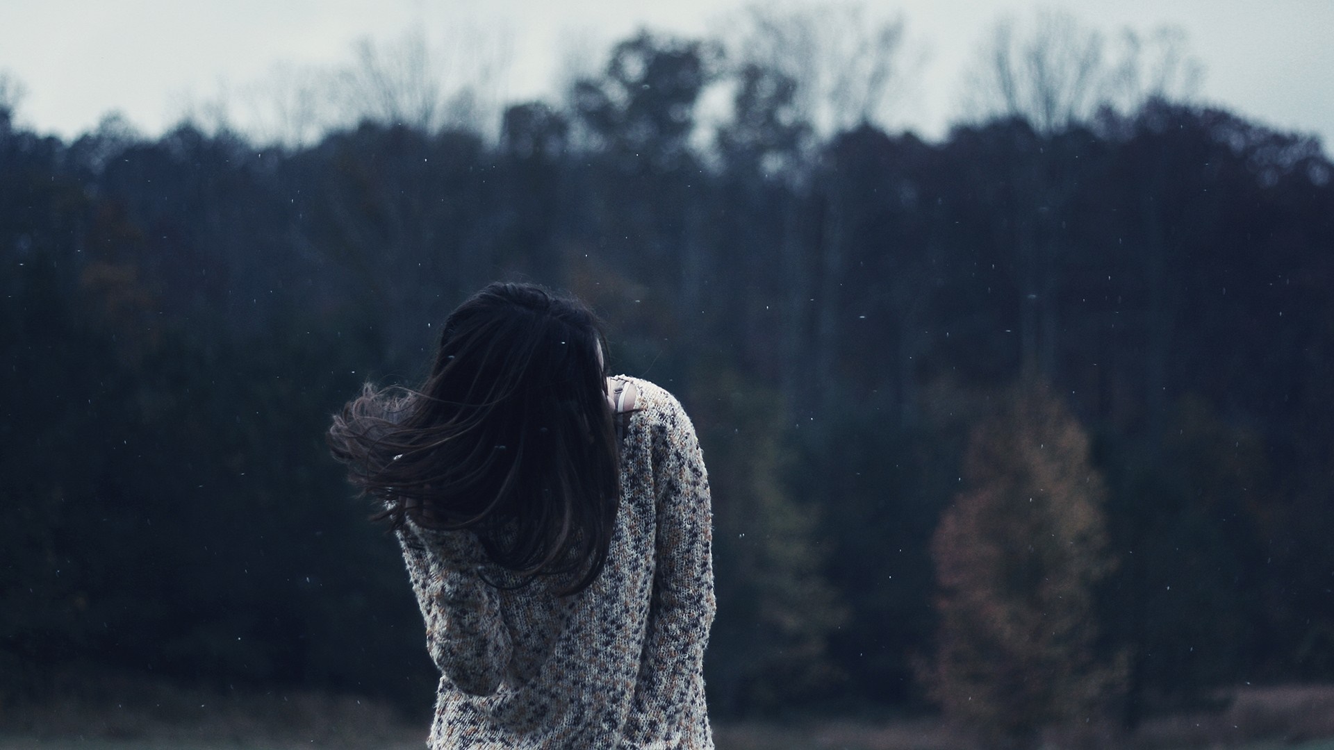 Woman in sweater in snowy forest HD Wallpaper