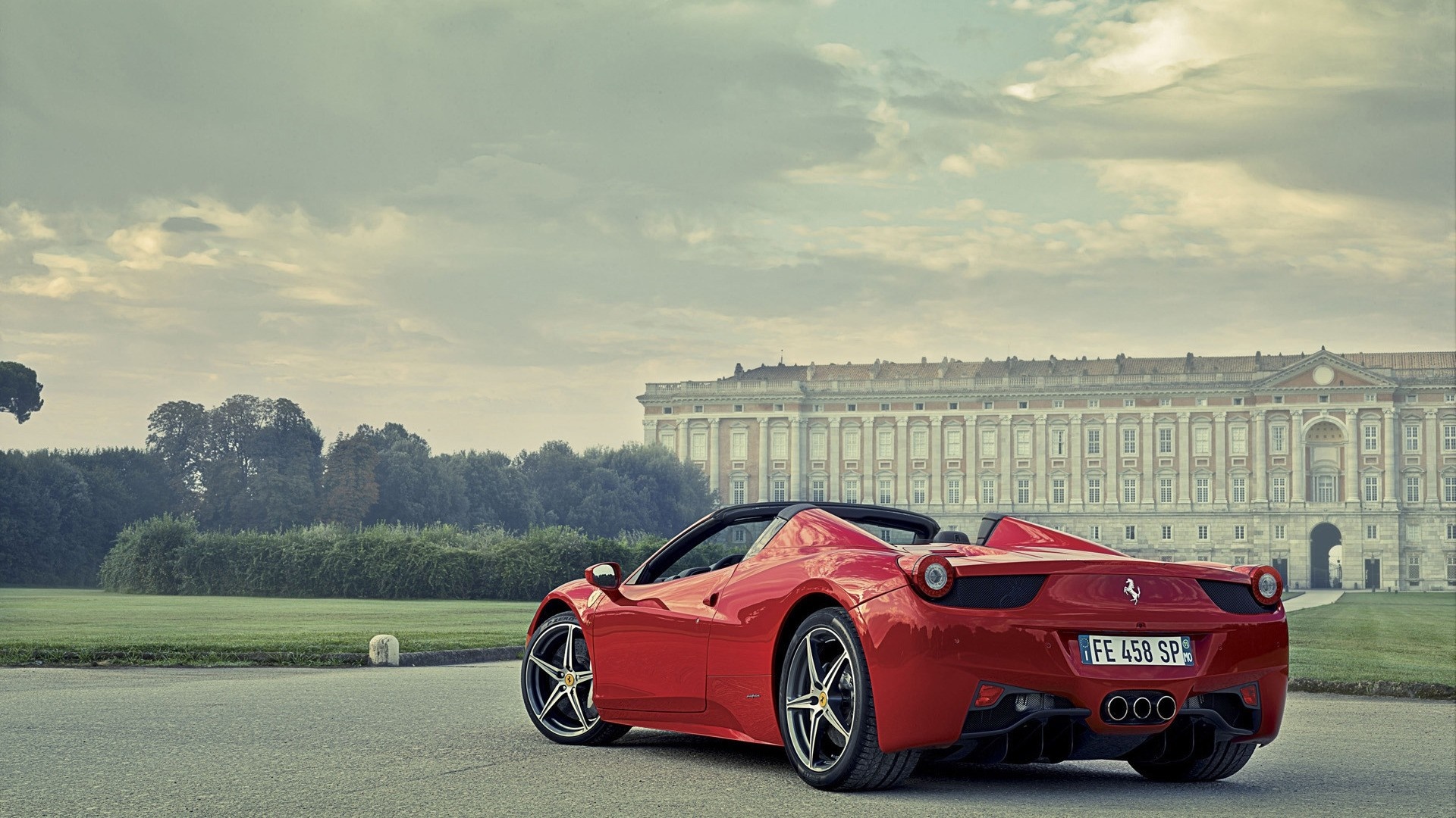 Red Ferrari 458 Spider parked in front of a palace HD Wallpaper