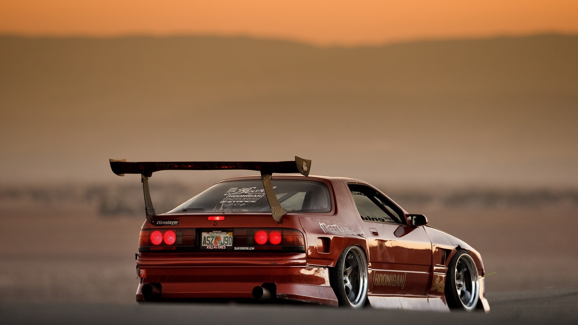 Red Mazda RX-7 with a large rear spoiler HD Wallpaper