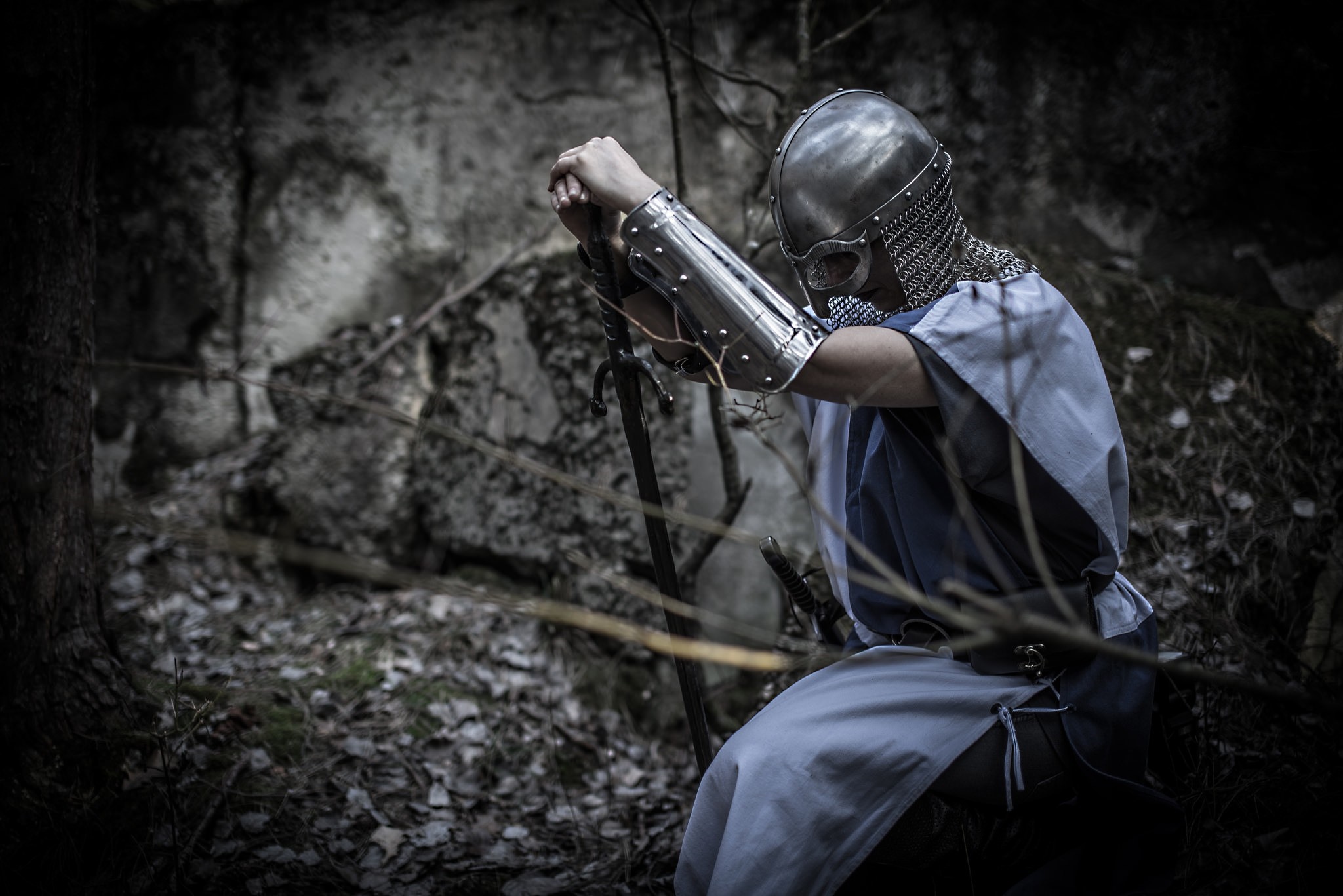 Knight in armor kneeling in forest HD Wallpaper