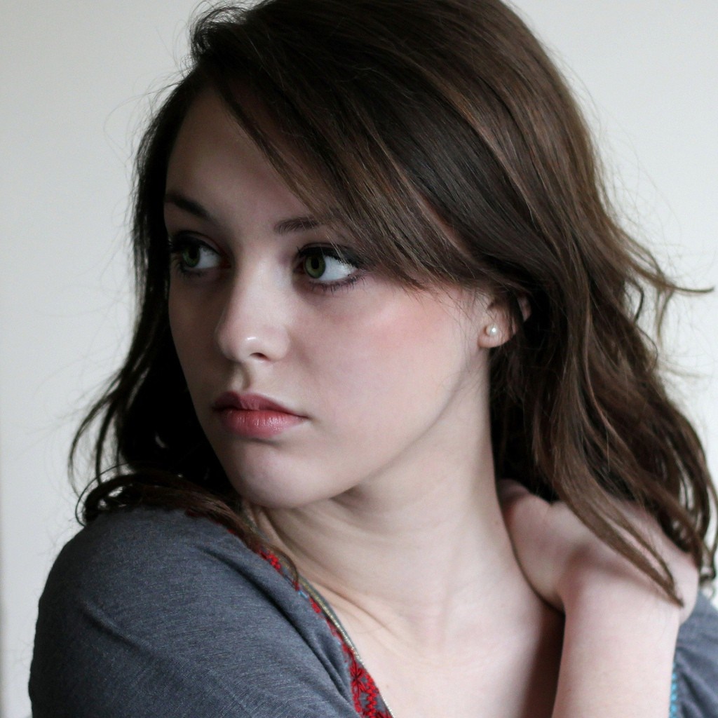 Portrait of a young woman with brown hair HD Wallpaper