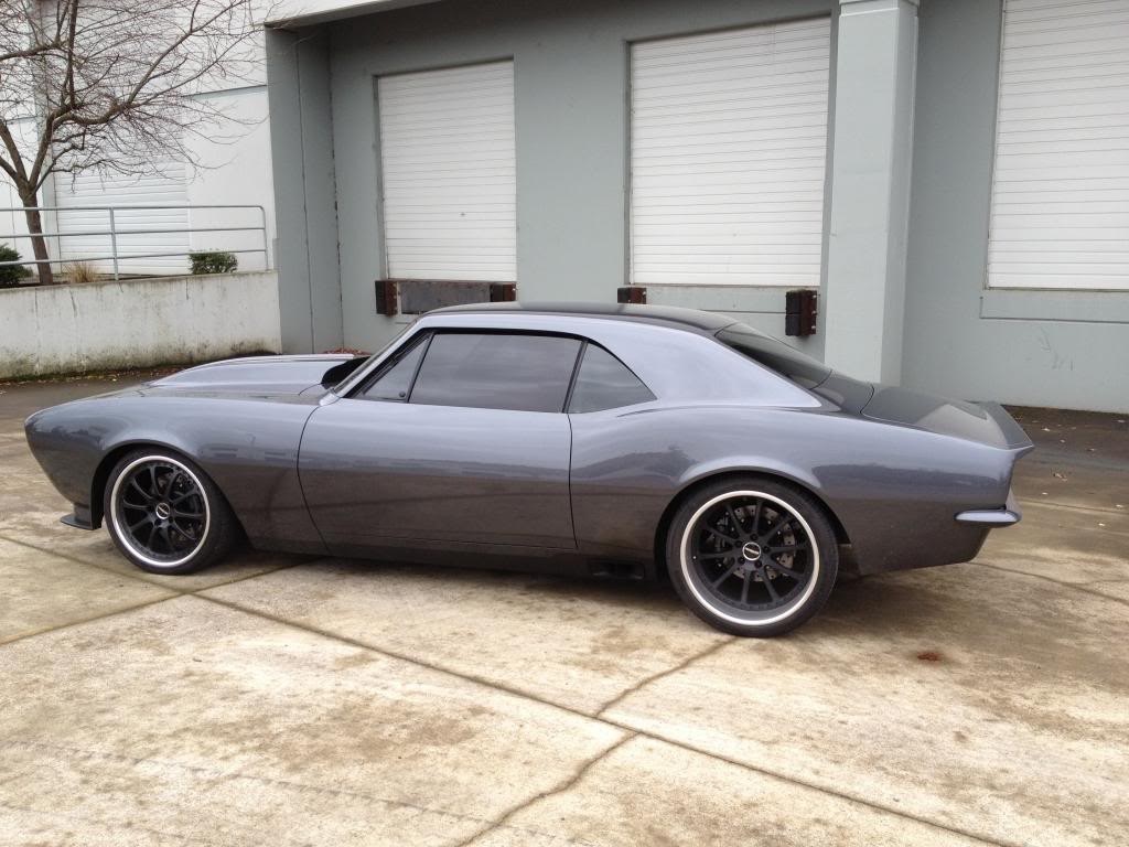 Custom gray Chevrolet Camaro parked outside a building HD Wallpaper