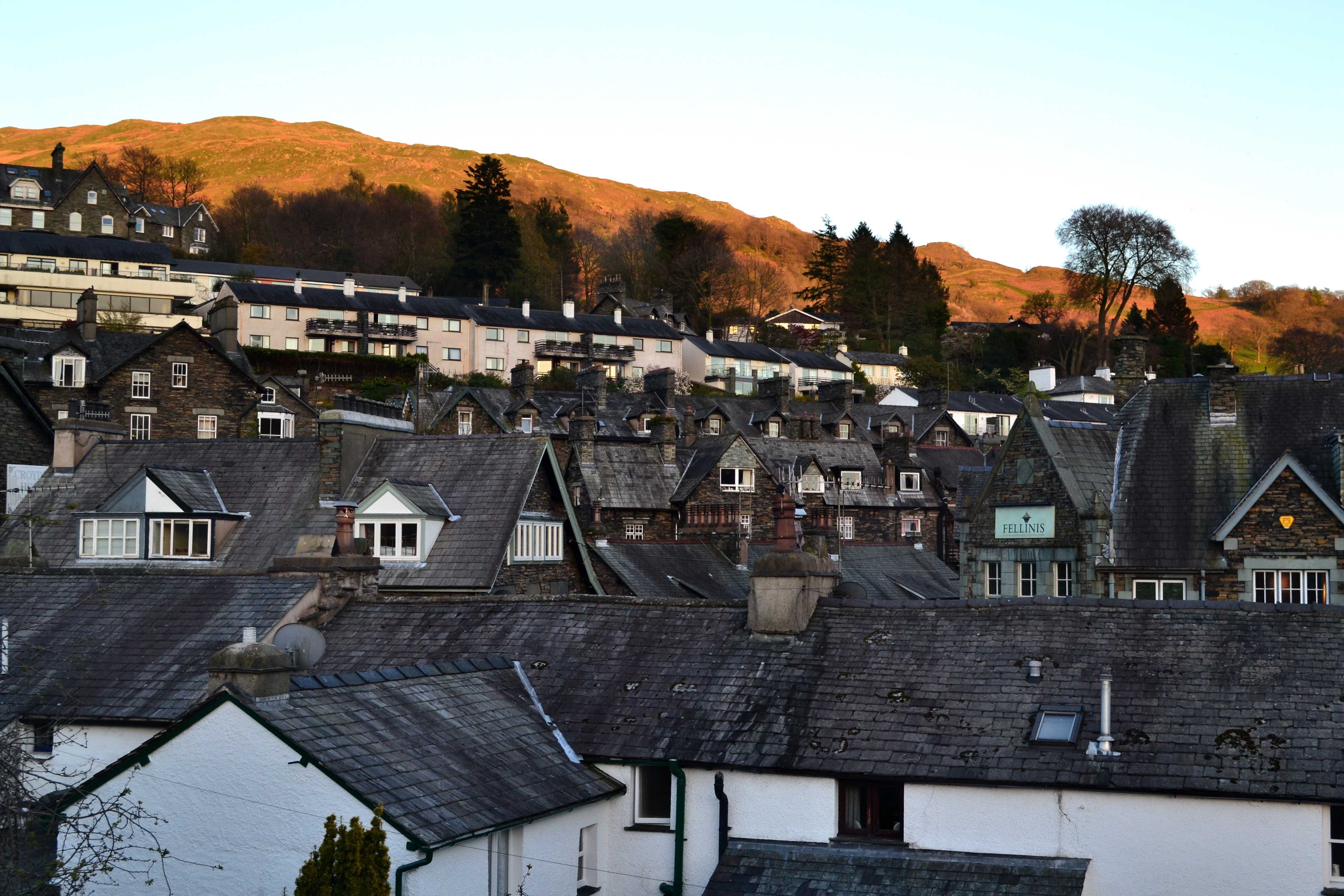 Townscape with rolling hills in the background HD Wallpaper