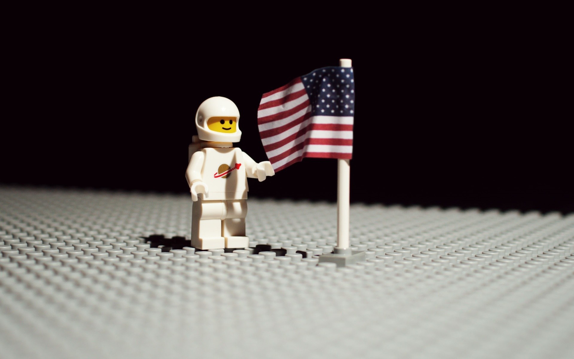 LEGO astronaut planting American flag on the Moon HD Wallpaper