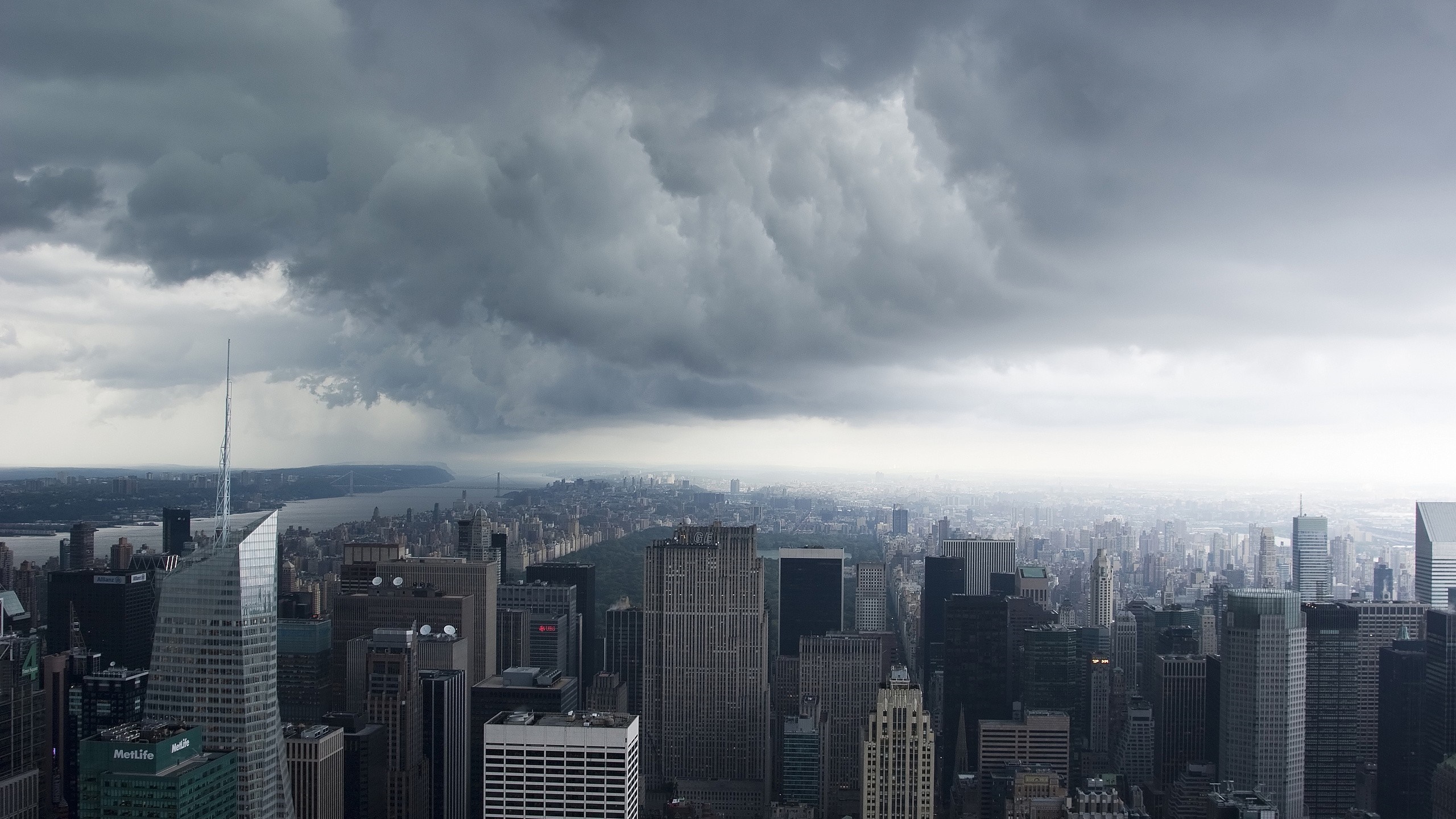 New York City skyline under stormy clouds HD Wallpaper