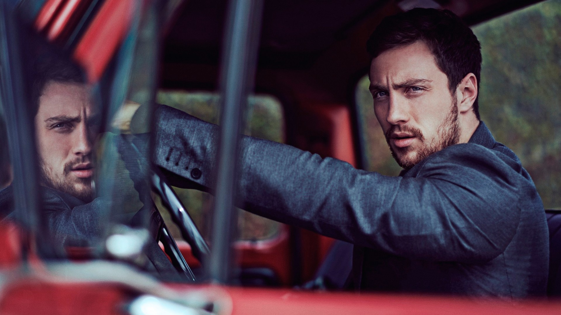 Aaron Taylor-Johnson in a car HD Wallpaper