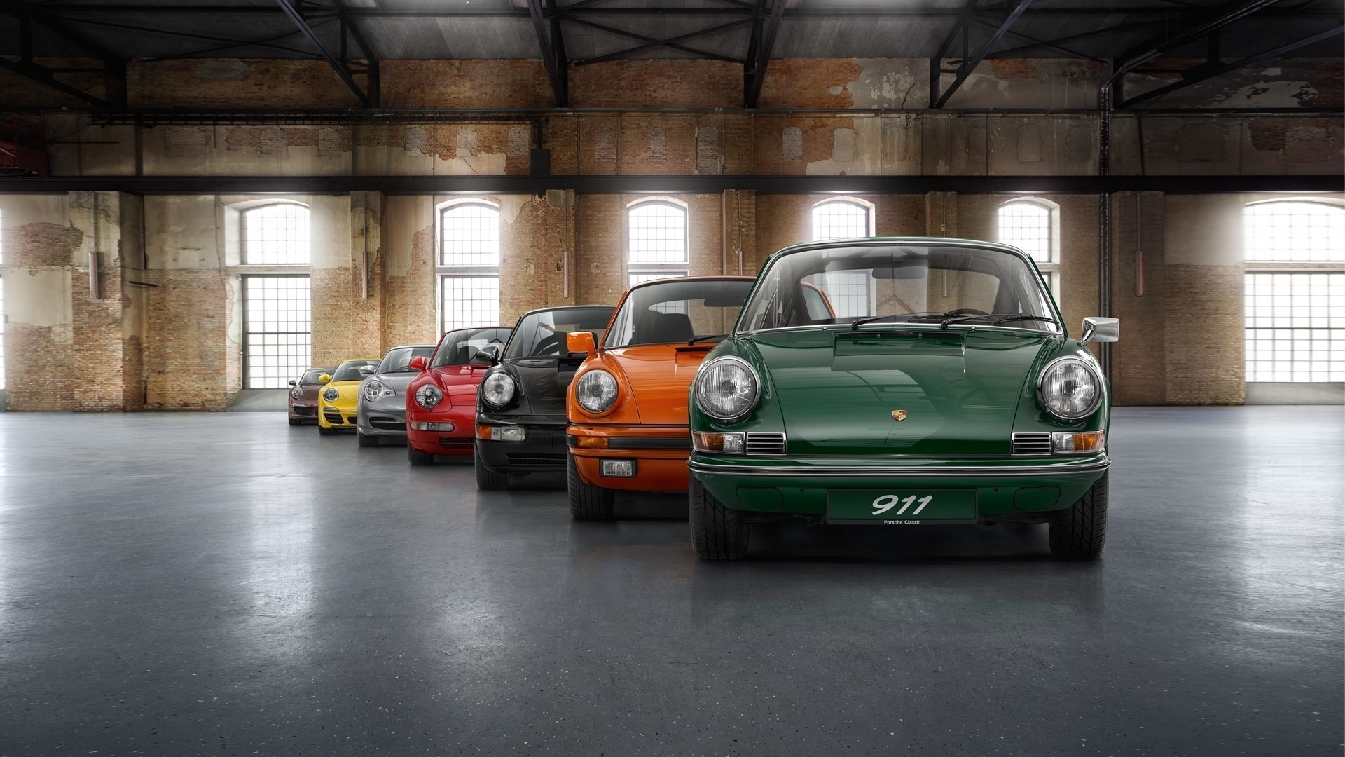 Porsche 911 cars lined up in a warehouse HD Wallpaper