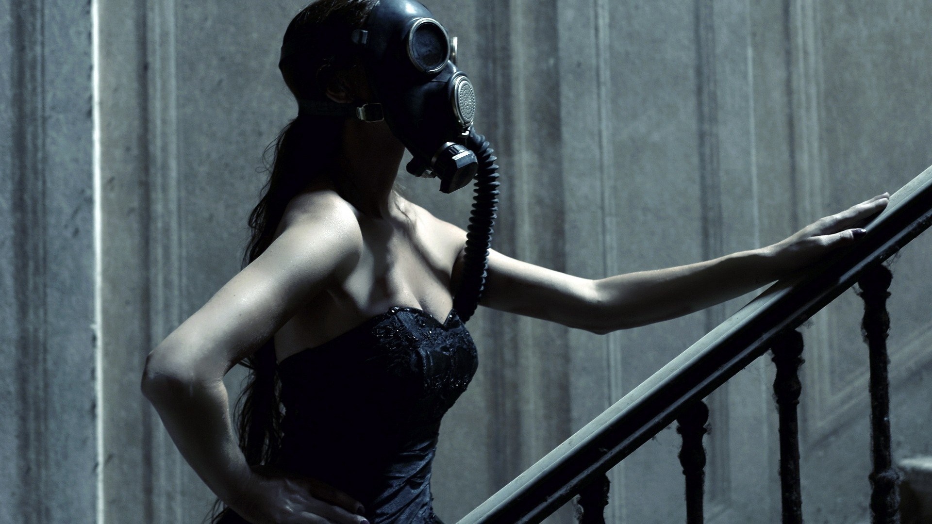Woman in black dress wearing gas mask on stairs HD Wallpaper