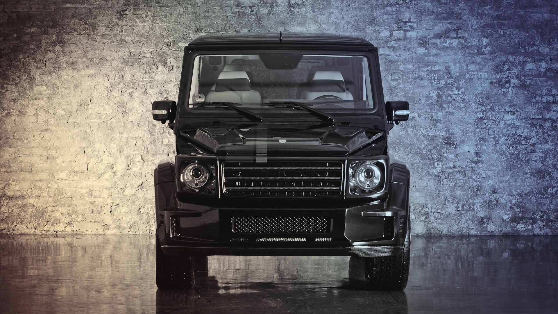 Black Mercedes-Benz G-Class SUV in front of brick wall HD Wallpaper