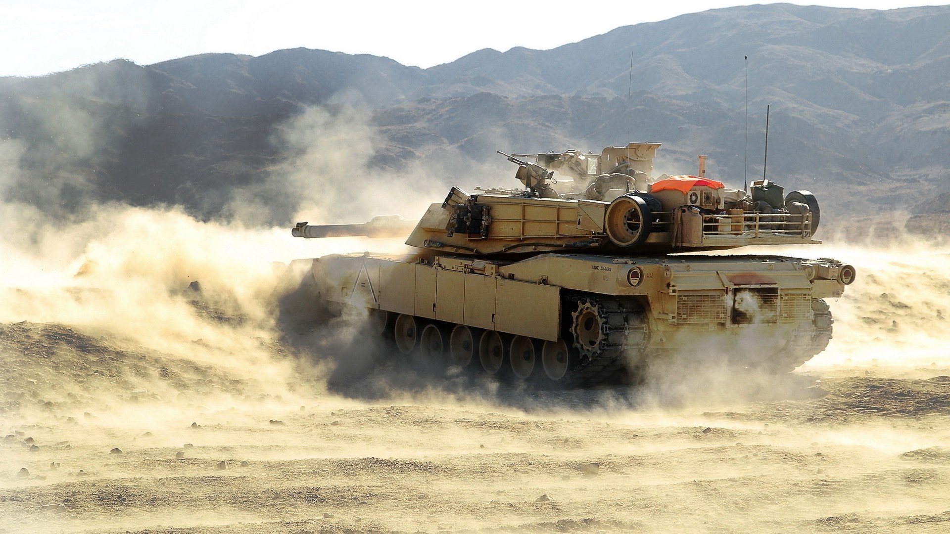 M1 Abrams tank in a desert environment HD Wallpaper