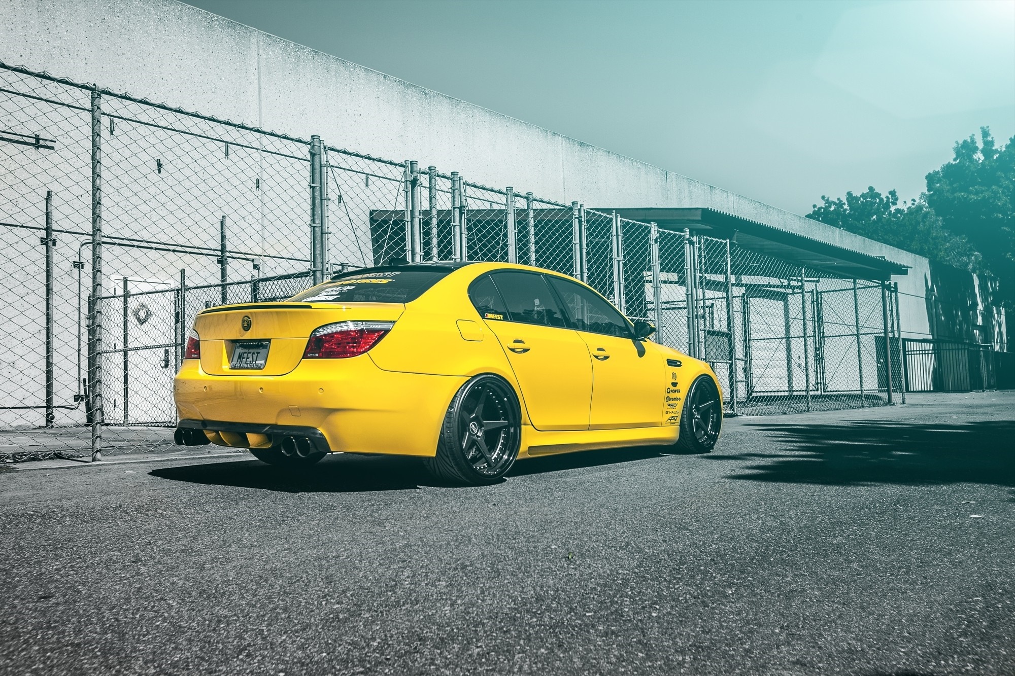 Yellow BMW M5 Sedan with custom wheels HD Wallpaper