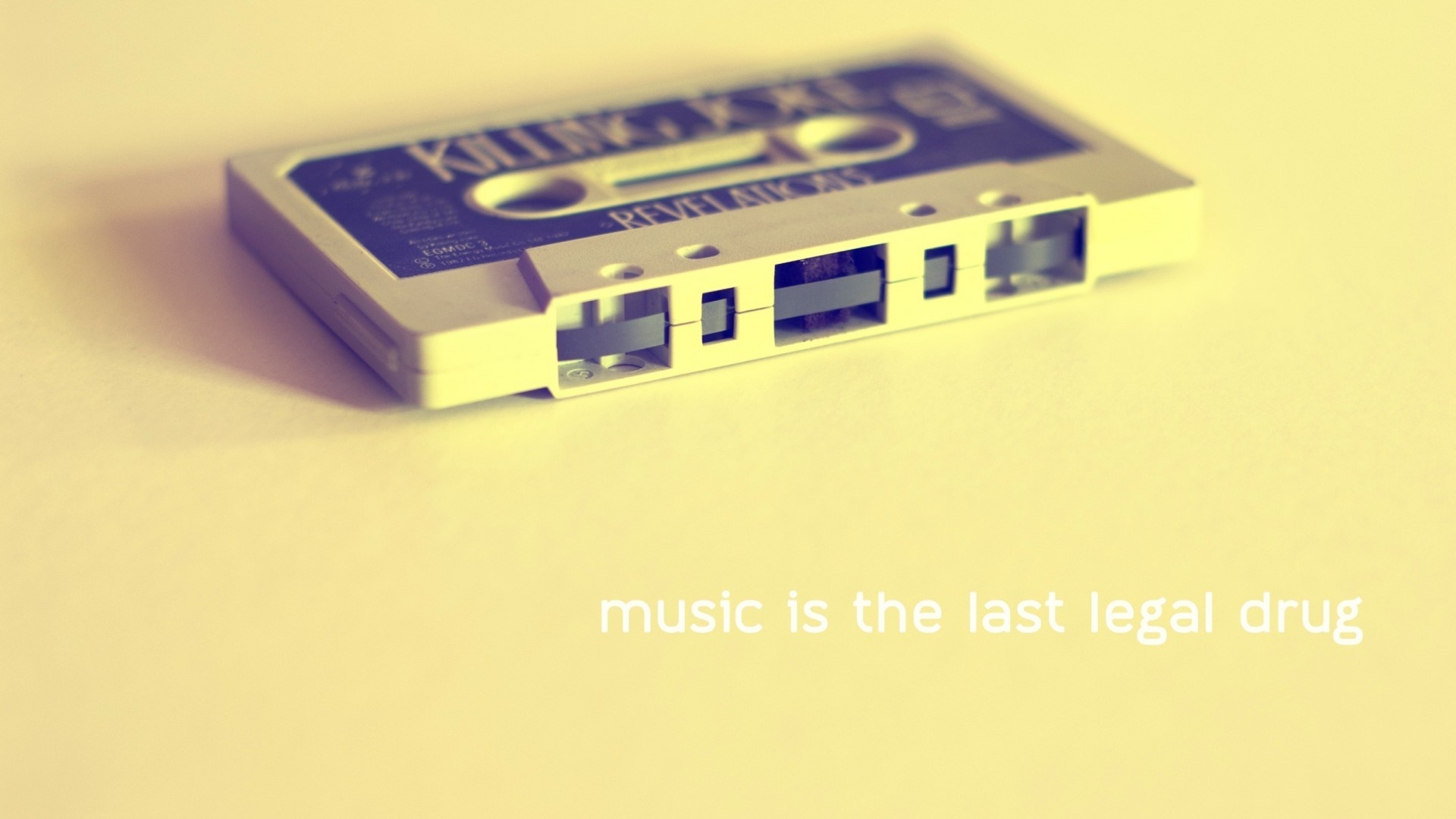 Cassette tape with text "music is the last legal drug" HD Wallpaper
