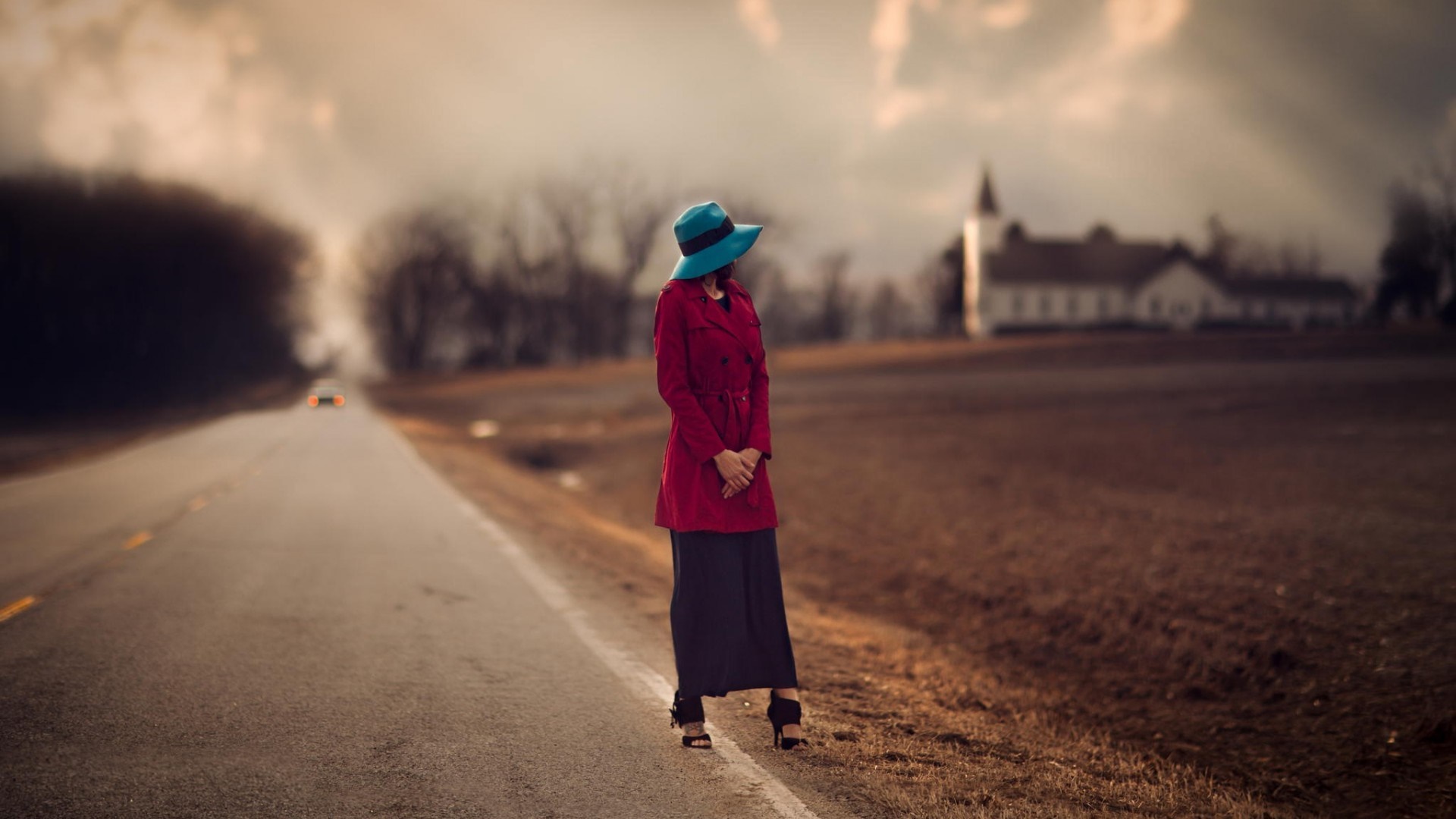 Woman in red coat and blue hat on a road HD Wallpaper