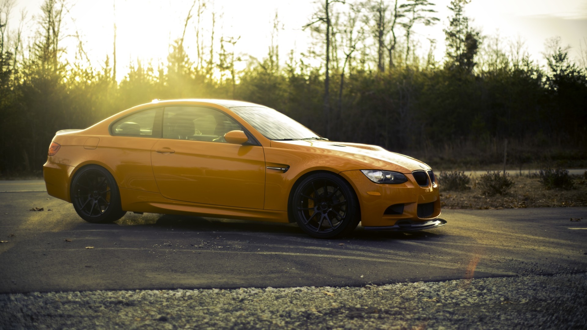 Orange BMW M3 Coupe on a Road HD Wallpaper