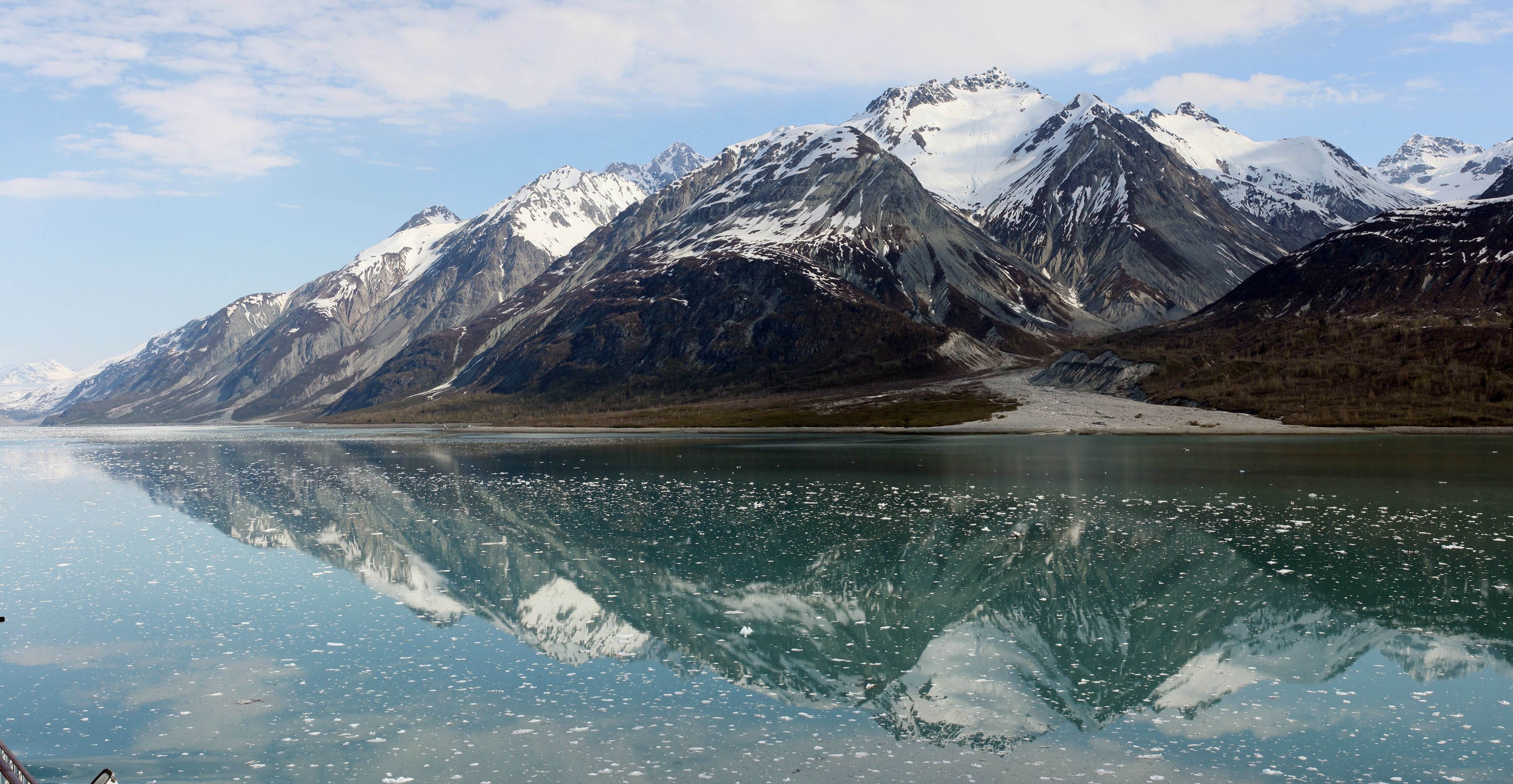 Snow-capped mountains reflected in a glacial lake HD Wallpaper