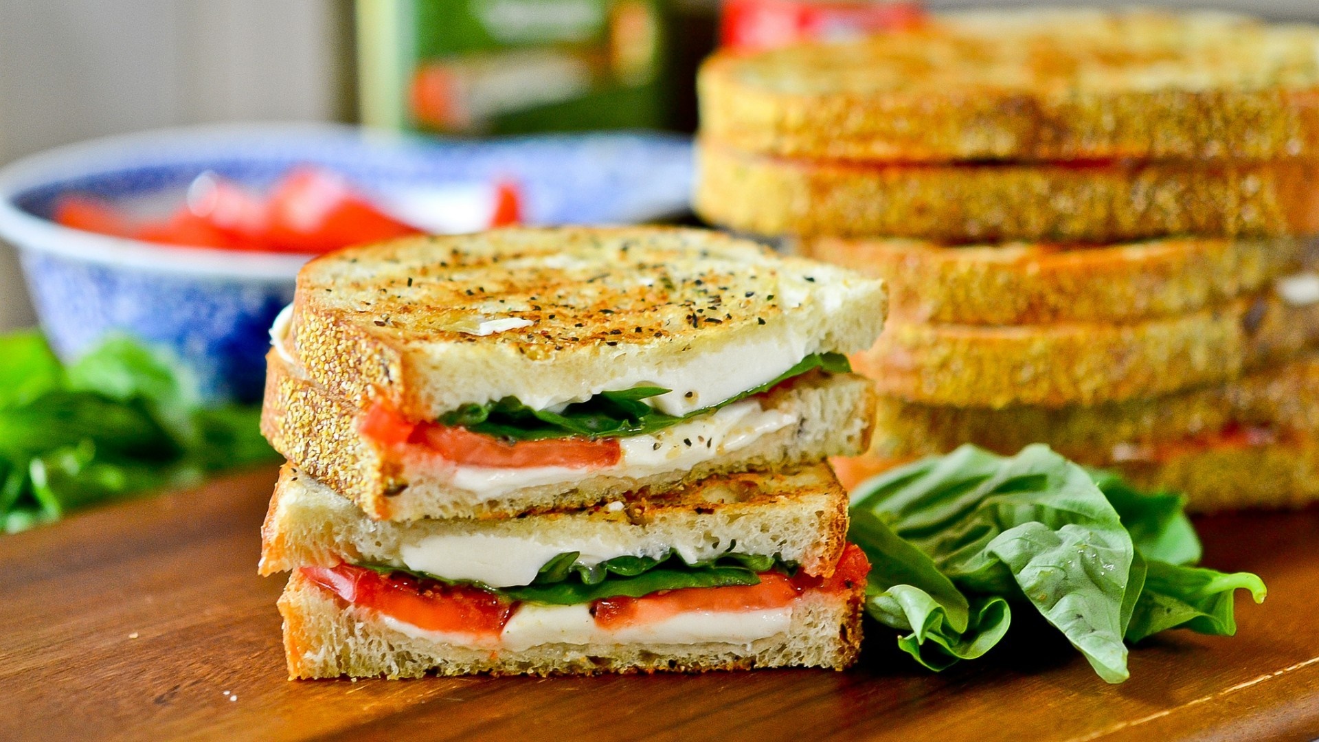 Caprese sandwiches with fresh basil and tomatoes HD Wallpaper
