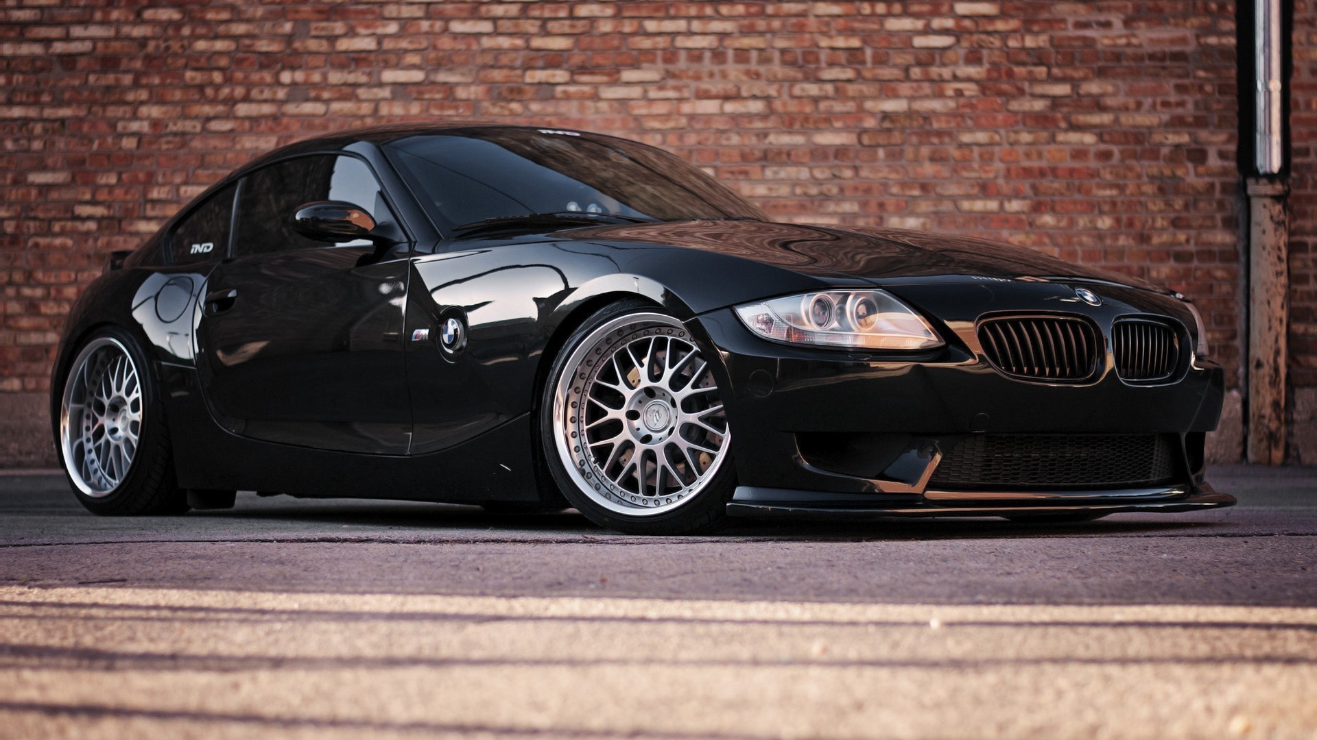 Black BMW Z4 Coupe with Custom Wheels HD Wallpaper